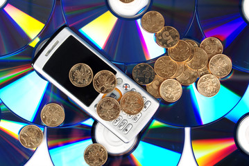 mobilphone on DVD with coins