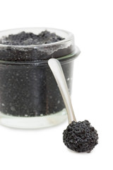 Fototapeta na wymiar Black caviar in a glass jar on a white background