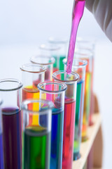 Hand carefully put liquid on test tube