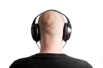 Bald man with headphones on white background
