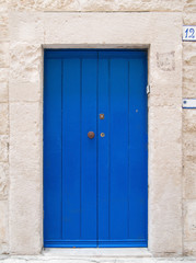 Blue wooden frontdoor.