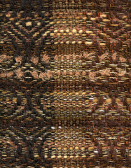 Detail of hand woven decorative brown fabric