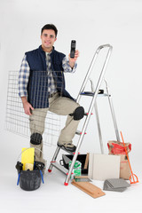 Carreleur avec t&eacute;l&eacute;phone portable