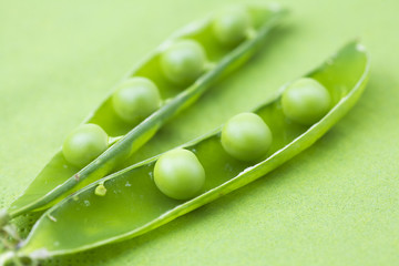 peas on a green background