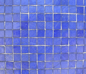wall with bright blue mosaic tiles