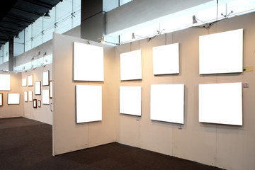 empty frames in a room against a white wall .