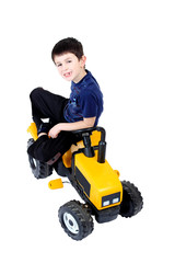 small boy on the yellow tractor