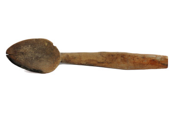 Old and used spoon isolated on white