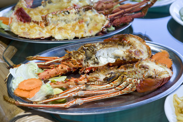 plates with lobster on table