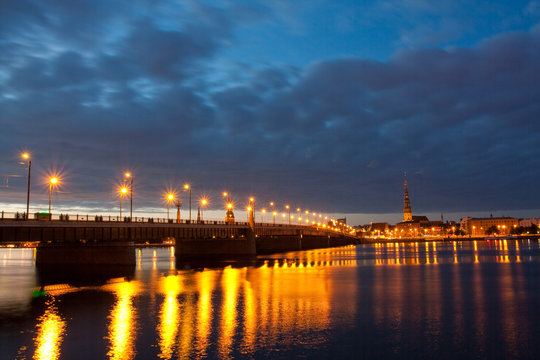 Night scene with city river and sky in  Riga