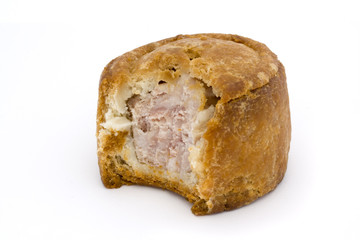 small pork pie with bite taken