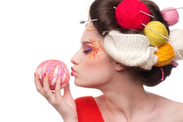Closeup fashion woman with color face art in knitting style