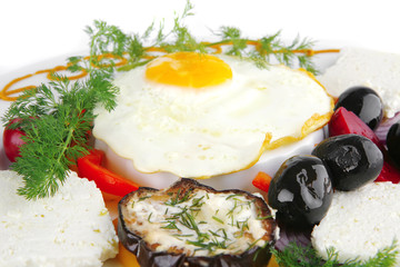egg on white plate with vegetables