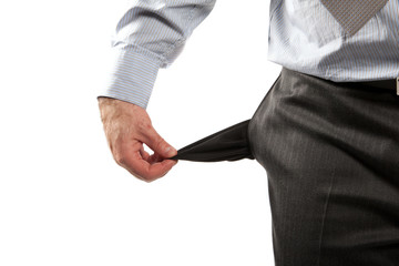 Disappointed businessman with empty pockets isolated over white