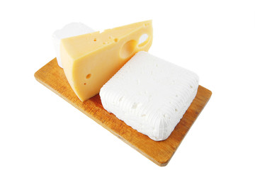 cheeses on wooden board