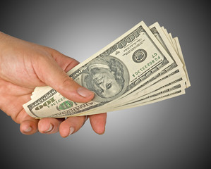 Hand with dollar bills isolated on background