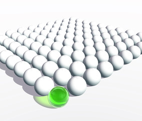Conceptual crowd of spheres with one green glass sphere