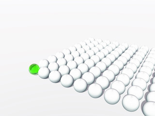 Conceptual crowd of spheres with one green glass sphere