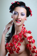Gorgeous portret of a young beautiful woman in roses © Alex Tihonov
