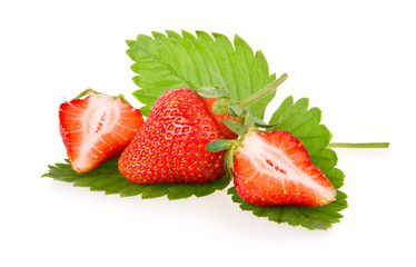 Red sliced strawberry fruits with green leaves