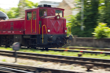 Red train engine in motion blur