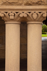 A photograph depicts closeup of two building pillars.