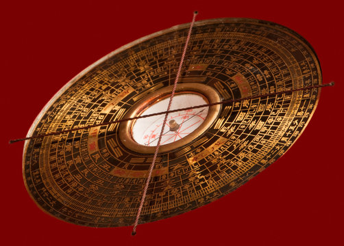 Feng Shui Compass Luopan On Red Background.