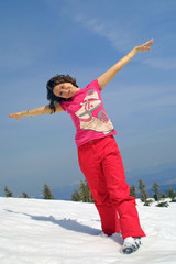 Happy girl relax on a mountain slope