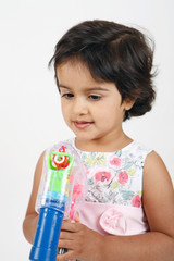 toddler playing with toygun