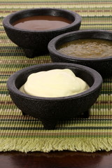 salsa verde,salsa roja and sour cream