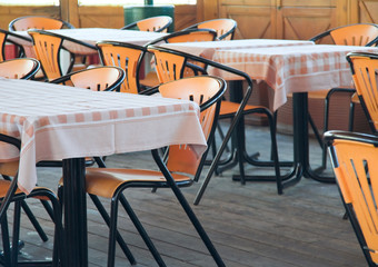 Table and chairs in empty restaurant.