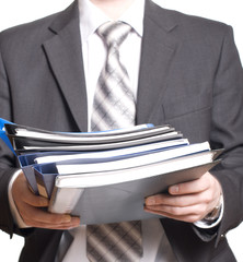 business man holding stack of files and folders