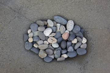Fototapeta na wymiar Pebbles in a rock pool