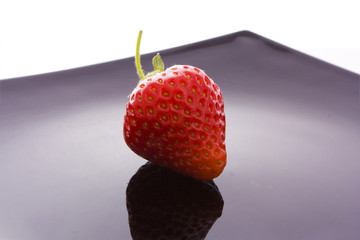 strawberry on black plate
