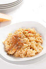 plate of rice and pork chops potatoes