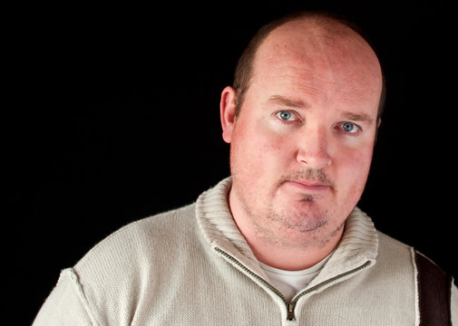 Portrait Of A Overweight Male On Black