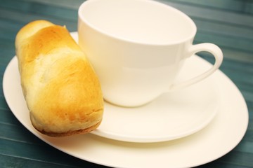 Kaffeetasse mit Brötchen