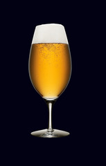 Glass of beer isolated on a black background