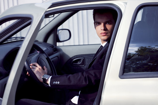 young businessman in his car
