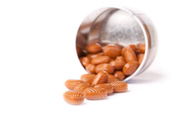 Overturned candy can isolated on a white.