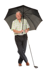 Happy casual mature golfer with umbrella