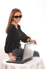 a woman with a laptop and long hair