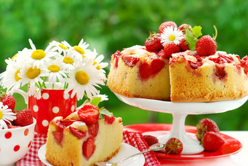 strawberry cake on table in the garden