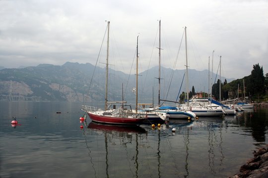 Yachts with down sails on Lago di Garda lake