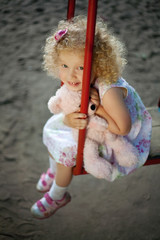 Little girl on the swing.