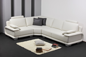 A modern minimalist living-room with white furniture