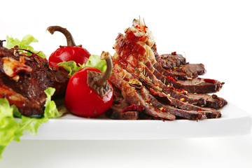 served meat on ceramic plate