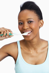 Young Woman Brushing Teeth In Studio