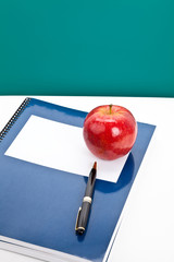 Red apple and Textbook