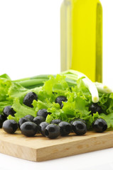 Black olives, greens and oil